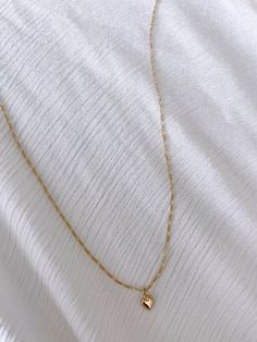 Tiny puff heart charm paired on our thin figaro chain 17 inches with 2 inch chain extender Gold Necklace, Necklaces, Gold, White