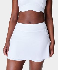 A multi-functional performance skort. Sweat-wicking fabric with lightweight and breathable over skirt. Supportive inner shorts. Inseam length: 5" / 12cm. Skirt length: 26.4cm from underband to hem. Model wears size S and is 178cm/5'10" tall. Style Code: SB2478Colour: White