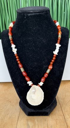 This necklace is made from red carnelian beads with gold beaded accent and a beautiful seashell from the clear blue waters in St Croix USVI. St Croix Usvi, Seashell Pendants, Clear Blue Water, Red Carnelian, St. Croix, Carnelian Necklace, St Croix, Carnelian Beads, Philadelphia Pa