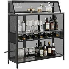 a metal shelf filled with lots of bottles and glasses