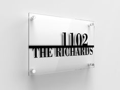 a glass sign that says the richards on it