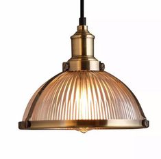 an antique style pendant light with a glass shade