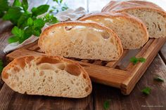 three pieces of bread sitting on top of a cutting board