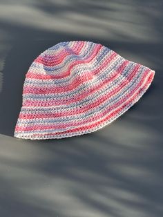 a crocheted hat laying on top of the water