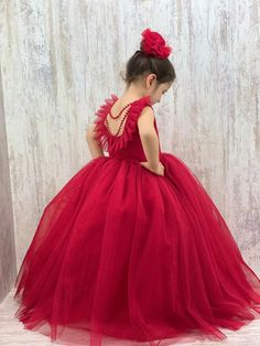 Make your little one's special occasions unforgettable with our stunning Red Baby Girl Dress. Perfect for New Year's celebrations, birthdays, and parties, this handmade dress features exquisite back pearl detailing that adds a touch of elegance and charm. Key Features: Design: Elegant red dress with beautiful back pearl detail, perfect for making a statement at any event. Sizes: Available in various sizes to fit baby girls comfortably. Material: Crafted from high-quality, soft, and breathable fa Red Ball Gown Dress For Dress-up Occasions, Red Sleeveless Princess Dress For Pageant, Red Ball Gown For Holiday Season, Red Ball Gown For Holiday, Holiday Red Ball Gown, Red Ruffled Gown For Pageant, Red Ruffled Gown For Pageants, Red Fitted Gown For Dress-up, Red Sleeveless Princess Gown