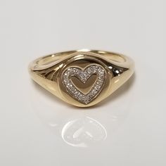 "Thanks for shopping our vintage estate store. We tend to sell well below wholesale and truly hope you enjoy all of our items. Many of the items are one of a kind, so please enjoy scrolling through the pictures and hopefully something will catch your eye. Brown spots are from camera or reflections. Estate 14k yellow gold heart .05ct Diamond ring. There are 20 diamonds in the setting. One of a kind only one we have. Ring size: 6.5 Setting: 3/8\" 10mm Band width: 2mm Weight: 3.39 grams Marked 14k and it's sweet. One that you will love." Heart-shaped Hallmarked Diamond Ring, Classic 14k White Gold Heart Ring, Timeless Gold Heart Ring For Anniversary, Classic Jewelry For Valentine's Day, Stamped 14k Diamond Ring For Valentine's Day, Classic Heart-shaped Brilliant Cut Diamond Ring, Heirloom Heart Cut Jewelry With Vvs Clarity, 14k Stamped Diamond Ring For Valentine's Day, Heart Cut Signet Ring For Anniversary On Valentine's Day