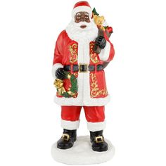 a santa clause figurine holding a christmas tree ornament in his hand