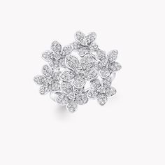 Arranged with a wild touch, a profusion of diamond blossoms make a strong statement upon our Wild Flower ring. Shimmering with diamonds, each petal is uniquely realised and placed to lift towards its wearer with extraordinary lightness, like flowers freshly bloomed. Updating the traditional English Garden with carefree charm and a contemporary spirit, four varieties of flower flourish in rare abundance in our Wild Flower garden, inspiring you to mix, match and make everyday diamonds your own. An Large Diamond Stud Earrings, Traditional English Garden, Triple Diamond Ring, Wild Flower Garden, Double Diamond Ring, Diamond Shaped Engagement Ring, Large Diamond Rings, Round Diamonds Wedding Band, Flower Diamond Ring