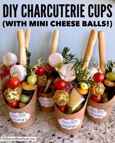 mini cheese balls are arranged in small cups with labels on them and labeled diy charcuterie cups