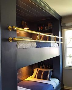 a bunk bed in a room with blue walls