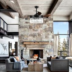 a living room filled with furniture and a fire place