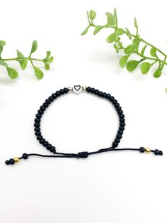 This chic bracelet is adorable! So simple yet so perfect and unique for every day wear. It is adjustable, waterproof, and very stylish. Combine it with any outfit. It is an ideal gift for friends and family. Show your love with this cute heart bracelet. Black Beaded Bracelet, Bracelet With Heart, Black Beaded Bracelets, Chic Bracelet, Family Show, Cute Heart, Heart Bracelet, Black Beads, Infinity Bracelet