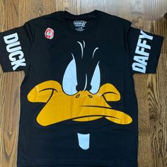 Nwot Smoke Free Home Looney Tunes Daffy Duck Tee Shirt Made In Peru Black Streetwear Shirt With Character Print, Casual Black Shirt With Character Print, Black Funny Print Graphic Tee, Black Graphic Tee With Cartoon Print, Black Shirt With Funny Print For Streetwear, Black Crew Neck Shirt With Cartoon Print, Casual Black Top With Funny Print, Black Cotton Tops With Funny Print, Black Cotton Top With Funny Print