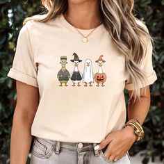 About this item Dive into the Halloween spirit with our delightfully quirky t-shirt featuring four geese dressed in their spookiest costumes! From a charming ghost to a cheeky pumpkin, each goose brings its own brand of festive fun to the party. This tee is crafted from soft, high-quality cotton to keep your little ones comfy while they enjoy all the Halloween festivities. Whether they're trick-or-treating or attending a spooky party, this shirt is sure to be a hit! DETAILS: BELLA+CANVAS®: 99% A Silly Halloween, Goose Dress, Funny Goose, Quirky T Shirts, Spooky Costumes, Spooky Party, Halloween Festivities, Halloween Spirit, Spirit Halloween