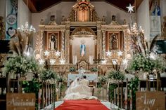 the bride and groom are sitting at the alter