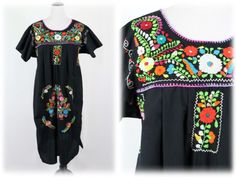 "Vintage Mexican dress. Polyester cotton blend fabric. Colorful cotton embroidery. Short sleeves. Straight bottom with small side slits. Only label is washed out. I would estimate this dress to be a modern size M/L. Freshly laundered. Excellent condition.  Measurements: Shoulders = 20\" from seam to seam Bust = 46\" Waist = 56\" Hips = 56\" Sleeves = 5\" Length from top of shoulder to hem = 46\" Circumference = 56\" All measurements are taken with the garment flat, doubled for the bust (chest), Black Cotton Folk Embroidered Dress, Casual Cotton Dress With Geometric Embroidery, Folk Style Embroidered Cotton Dress With Short Sleeves, Black Cotton Embroidered Short Sleeve Dress, Black Cotton Embroidered Dress With Short Sleeves, Cotton Embroidered Dress With Short Sleeves For Festivals, Black Cotton Embroidered Dress, Muu Muu Dress, 1910 Dress