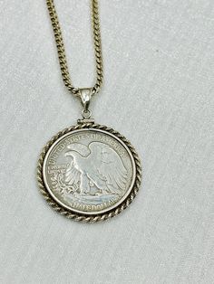 USA 1944 - S Walking Liberty  Sterling Silver Half Dollar  Coin Edge Bezel.  1944 USA. 999 silver eagle  coin Pendant  on a sterling silver Italian rope chain .The total weight: 33.5 grams .  The pendant contains  an authentic 1944 standing liberty silver half dollar / 50 cents coin .  Condition: Pre-owned. Classic Stamped 925 Medallion Jewelry, Classic Engraved Sterling Silver Coin Necklace, Silver Coin Jewelry Stamped 925, Silver Coin-shaped 925 Stamped Jewelry, Classic White Gold Coin Necklaces, Silver Coin Necklace For Anniversary, Vintage White Gold Nickel-free Necklace, Silver Round Coin Necklace For Anniversary, Vintage Sterling Silver Coin Jewelry