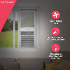 an air conditioner sitting in front of a window with instructions on how to use it