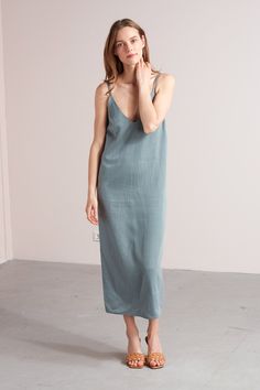 "Hani dress. ✦ EFFORTLESS. CHARMING. CALM. ✦ This slip dress made from extremely soft cupro & cotton fabric will give your summer wardrobe an elegant update. Styling tip for those cooler days: combine with a lightweight jumper or classy blazer. ✅ SIZE & FIT Model is 173 cm/5'7\" and wears size S. XS: Bust - 86 cm / 33,9\", Hips - 94 cm / 37\", Full length - 125 cm / 49,2\" S: Bust - 90 cm / 35,4\", Hips - 98 cm / 38,5\", Full length - 125 cm / 49,2\" M: Bust - 94 cm / 37\", Hips - 102 cm Blue Spring Dresses, Midi Slip Dress, Maxi Slip Dress, Dress Beach, Dinner Dress, Basic Dress, Beach Dresses, Strap Dress, Beach Dress