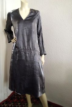 90s iridescent dress, grunge party dress, shiny wrinkled dress, V-neck, glitter dress, evening dress, metallic silver dress, bias sparkle dress measurements lying flat : shoulders :41 cm (16 inches)  bust :49 cm (19,5 inches)  hips :52cm (20,5 inches)  waist :55cm (21,5 inches)  total length :116 cm (45 inches)  sleeve length :62 cm (24,5 inches) Grunge Party Dress, Metallic Silver Dress, Grunge Party, Dress Grunge, Silver Metallic Dress, Iridescent Dress, Sparkle Dress, Glitter Dress, Dress Measurements