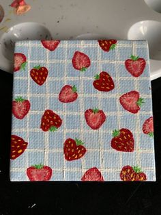 there is a cloth with strawberries on it