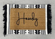 a door mat with the name harry on it and a black and white striped border