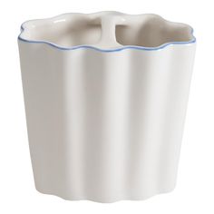 a white ceramic vase with blue trimmings on the rim and bottom, sitting in front of a white background