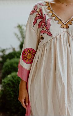 Get ready to embrace your inner bohemian with this Indie Embroidered Dress. In a stunning combination of ivory and pink, this dress features intricate embroidery, 3/4 sleeves, and a loose and flowy fit. With a V-neck and convenient pockets, this dress is not only stylish, but also functional. Perfect for festivals, picnics, or any day when you want to feel free-spirited! Oversized fit, so size down if in between sizes! Redesigned Clothes, Hand Embroidered Dress, Indie Dresses, Hippie Lifestyle, Denim Accessories, Intricate Embroidery, Embroidered Clothes, Embroidery Ideas, Free Spirited