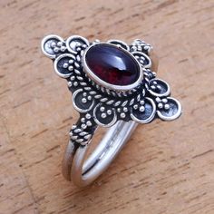 For a dreamy accessory to add to your wardrobe this cocktail ring is designed by Bali's Ketut Sulastri. She handcrafts the ring of sterling silver with an intricate crown that is centered by an oval cabochon of gleaming red garnet. Dream Jewelry, Jewelry Packaging, Red Garnet, Oval Cabochon, Cocktail Ring, Jewelry Gift Box, Free Jewelry, Cocktail Rings, Handcrafted Jewelry