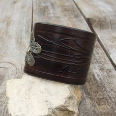 Made from top quality Italian vegetable tanned leather.Hand dyed and embossed with bronze butterfly.Cuff is 2" (5 cm) widePlease measure carefully your wrist and select the most preferable size!If you need a diferent size, please let me know after purchase in "note for seller".Please visit to my another shop:https://www.etsy.com/shop/JeansBelt?ref=hdr_shop_menu**************************************************************************FEDEX to USA and Australia!If you need a faster shipping please Vintage Hand Tooled Cuff Bracelet For Festivals, Vintage Hand-tooled Cuff Bracelet For Festivals, Rustic Cuff Bracelet For Festivals, Brown Stamped Bohemian Cuff Bracelet, Bohemian Brown Cuff Bracelet With Patina, Bohemian Stamped Brown Cuff Bracelet, Brown Bohemian Stamped Cuff Bracelet, Hand Tooled Cuff Bracelet For Festival, Festival Hand Tooled Cuff Bracelet