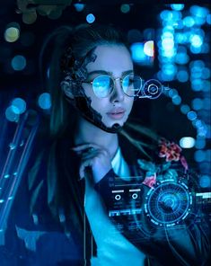 a woman with glasses holding a camera in front of her face and looking at the camera