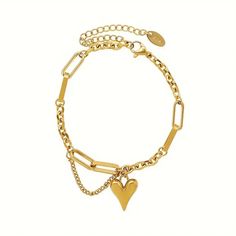 Gold-plated stainless steel bracelet with paperclip and curb chains. A short chain dangles next to a 3-dimentional 1/2" gold heart charm. 6" w/2" extender; lobster clasp. Trendy Gold Heart Bracelet With Adjustable Chain, Trendy Gold Heart Bracelet With Chain, Gold Heart Charm Bracelet With Chain, Gold Heart-shaped Charm Bracelet With Adjustable Chain, Trendy Heart-shaped Chain Bracelets, Metal Chain Link Bracelet With Charms, Trendy Gold Heart Charm Bracelet, Trendy Gold Heart Bracelet With Heart Charm, Trendy Heart-shaped Chain Bracelet