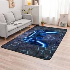 a living room area rug with a blue neon sign on the floor in front of a couch