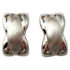 14K White Gold X Earrings - These gorgeous earrings are a staple to any outfit. Size: 17.6mm X 10.9mm X 4.8mm Weight: 3.5dwt. / 5.5 gr. Marked: 14KT Very good condition, professionally polished. Will come packaged in a gift box or pouch (when possible) and will be shipped U.S. Priority Mail Insured. AD04212024 Modern Polished Clip-on Earrings For Anniversary, Modern Sterling Silver Huggie Earrings For Formal Events, Elegant Sterling Silver Oval Huggie Earrings, Modern Sterling Silver Huggie Earrings For Formal Occasions, Anniversary White Gold Clip-on Earrings, Luxury Silver Clip-on Earrings With Polished Finish, Classic White Gold Clip-on Earrings With Polished Finish, Hallmarked Sterling Silver Huggie Earrings For Formal Occasions, Formal Oval Earrings With Shiny Finish