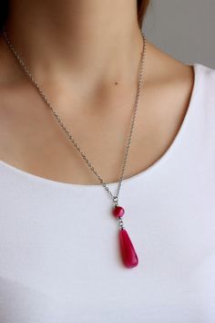 This bright pendant necklace was made of bright pink agate teardrop stone bead, small faceted pink agate stone 8 mm bead, small steel beads and cable stainless steel chain with stainless steel lobster claw. Perfect jewelry for everyday wear or a wonderful gift for someone special! The length of necklace is about 51 cm or 20.1 inch. Please,note: The color of the live product may some differ from the photo depending on the brightness settings of your monitor. Other necklaces of my shop you can see Polished Onyx Beads Necklaces, Drop Necklace Silver, Black Gemstone Necklace, Pink Gemstone Necklace, Silver Drop Necklace, Black Onyx Jewelry, Onyx Jewelry, Pink Agate, Pink Necklace