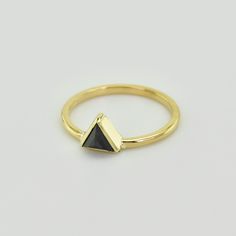 "This, edgy, black diamond triangular ring, is a must for all \"fashionistas\"! Sharp geometric jewely has become extremely popular and is featured in runway collections, fashion magazines and even on the red carpet. The point-down triangle celebrates female energy and the feminine elements of water and earth. This simplistic, but stunning ring can be handmade to your individual specifications, in 14k Rose, Yellow or White Gold with a highly polished finish. This is the perfect gift to embrace y Modern Diamond-shaped Promise Ring, Modern Gold Trillion Cut Diamond Ring, Modern Black Rings For Party, Modern Black Party Rings, Modern Black Triangle Jewelry, Gold Black Diamond Ring, Gold Ring Unique, Female Energy, Triangle Diamond