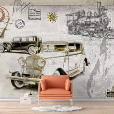 an old fashion car and train wall mural in a living room with orange chair next to it