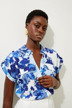 Floral Printed Viscose Crepe Woven Shirt Spring Vacation Tops With Collared Neckline, Summer Floral Print Collared Top, Summer Floral Print Tops With Collared Neckline, Summer Floral Print Top With Collared Neckline, Blue Summer Blouse With Collared Neckline, Blue Collared Blouse For Summer, Blue Collared Blouse For Vacation, Blue Collared Neckline Summer Blouse, Chic Blue Shirt With Collared Neckline