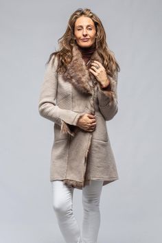 A flattering, timeless piece that can be worn indoors as a luxurious long cardigan or outdoors as a sweater coat. While the wool cashmere knit is tight enough to protect against a certain amount of wind, it is also thin enough to layer under a heavier coat during the colder winter months. Shearling details down front of coat, on cuffs, and lapel Comfortable hand pockets are positioned towards the front of the piece and not on the hips to enhance its flattering silhouette Cuffs can be folded back Long Knit Sweater Coat, Long Sweater Coat, Knit Sweater Coat, Long Knit Sweater, Cashmere Jacket, Heavy Coat, Suede Fashion, Long Sweater, Long Knit