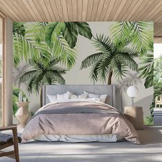 a bedroom with a palm tree mural on the wall next to a bed and chair