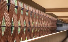 the inside of a building with wooden slats