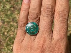 THIS RING IS ADJUSTABLE ! This beautiful pachamama (mother earth) ring is made by hand by the beautiful Quechua people of the Peruvian Andes.    It is made by 950 silver and Chrysocolla Stone Weight : 6.4 gr Width : 1.8 cm It is handmade in 950 silver with inlaid stone and shell by a local family of jewelry artisans. Unique Green Fair Trade Jewelry, Green Handmade Fusion Rings, Nickel-free Green Bohemian Rings, Nickel Free Green Bohemian Rings, Bohemian Nickel-free Green Rings, Bohemian Green Nickel-free Rings, Bohemian Spiral Rings As A Gift, Green Handmade Turquoise Ring For Spiritual Use, Bohemian Green Untreated Rings