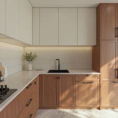 a kitchen with wooden cabinets and white counter tops