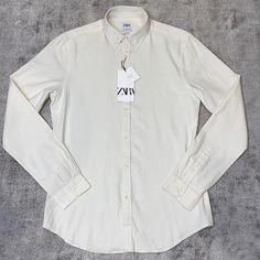 Off White Color White Classic Slim Fit Blouse, Classic White Slim Fit Blouse, White Slim Fit Spring Blouse, Casual Off-white Top For Work, White Cotton Slim Fit Shirt, White Slim Fit Cotton Shirt, Classic Cream Cotton Blouse, Classic Off White Long Sleeve Tops, Classic Off-white Long Sleeve Tops