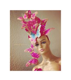 Kentucky Derby Fascinator in hot pink, teal, and gold. Complete show-stopping butterfly headpiece will bring a dazzling look to your ensemble!  Exciting dancing butterfly cascade. These butterflies have a secret--they are made from FEATHERS! And though this is a dramatic fascinator, it's incredibly light.  Stand out with this show-stopping fascinator, perfect for race day or wedding! Made to order. Please allow for slight variations. Some customizations may be available; please inquire. Perfect Pink Carnival Headpieces, Whimsical Pink Costume Hats And Headpieces For Carnival, Whimsical Pink Costume Hats For Carnival, Pink Whimsical Costume Hats For Carnival, Adjustable Pink Headpiece For Costume Party, Whimsical High Crown Fascinator For Party, Whimsical Festival Headpieces For Parties, Whimsical Headpieces For Festivals And Parties, Adjustable Pink Carnival Hat