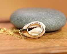 Cowrie shell necklace - colored shell - summer necklace - gold cowrie shell - beach - bff necklace - sea shell necklace A perfectly one of a kind gold lined cowrie shell hanging happily from a 14k gold vermeil chain at the length of your choice! Because of nature and all its beauty, the shell you receive may have a slight variation in shape. the shell measures aprox 18mm-20mm from top to bottom :) SHELL COLORS: +Turquoise +Pink +White +Mint +Purple ♥ Handmade with love in sunny California ♥ This Gold Cowrie Shell As Gift, Cowrie Shell Necklace As A Gift, Cowrie Shell Necklace As Gift, Cowrie Shell Necklace Gift, Gold Cowrie Shell Necklace For Vacation, Gold Shell Necklaces For Beach, Beachy Gold Shell-shaped Necklaces, Beachy Gold Shell-shaped Necklace, Gold Shell Necklace Beachy Style