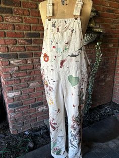 Gear up for fall in hand-painted Dickies overalls with plaid and floral patchwork, topped off with a Smokey the Bear patch 🐻🍁 Rugged, unique, and made to stand out--whether you're on the go or on the job.  Size large flat measurement waist 20"  inseam 29" Womens Painting Overalls, White Paint Splattered Overalls, Crust Overalls, Painter Overalls, Painted Overalls, Painters Overalls, Dickies Overalls, Plaid And Floral, Smokey The Bear