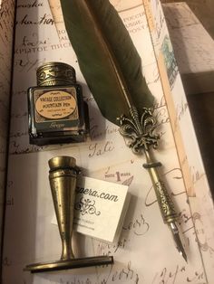 an old fashioned fountain pen, inkwell and quill