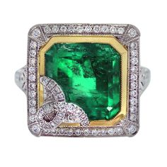 Emerald, Platinum, Yellow Gold, Diamond Cocktail Ring This estate, vintage Emerald gemstone, and natural diamond ring makes a huge statement. This ring is fun for a night out and will be an excellent addition for any holiday party looks. Gemstones are popular around the holidays because of their vibrant colors but can be worn year-round. Style: Emerald, Platinum, Yellow Gold, Diamond Cocktail Ring Main Stone: Square Emerald, measuring approximately 12mm x 11mm Stone Carat Weight: 8.65 carats Sto Vintage Cocktail Ring, Yellow Gold Diamond Ring, Gold Cocktail Ring, Natural Diamond Ring, Yellow Gold Jewelry, Colombian Emeralds, Diamond Cocktail Rings, Gold Diamond Ring, 18k Gold Ring