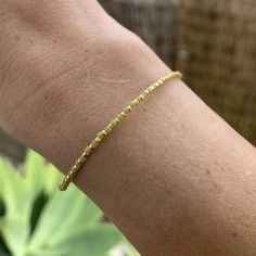 lime green and gold colored seed bead bracelet strung on elastic please gently roll on and off to prolong its life handmade in venice, ca Adjustable Gold Beaded Chain Friendship Bracelets, Adjustable Yellow Gold Bracelet With Tiny Beads, Adjustable Gold Stretch Bracelet Hand-strung, Dainty Adjustable Gold Beads Stretch Bracelet, Dainty Adjustable Hand-strung Gold Bracelet, Dainty Adjustable Stretch Bracelet With Gold Beads, Adjustable Hand-strung Gold Stretch Bracelet, Dainty Adjustable Gold Bracelet Hand-strung, Gold Beaded Chain Bracelet For Everyday